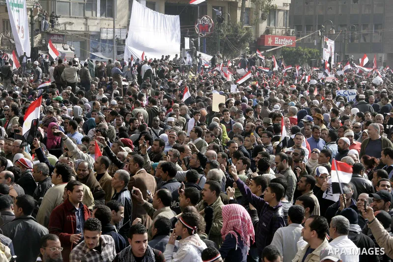 Anti-government protesters take part in demonstrations in Tahrir Square in downtown Cairo, Egypt, Tuesday, Feb. 8, 2011. Protesters appear to have settled in for a long standoff, turning Tahrir Square into a makeshift vi...