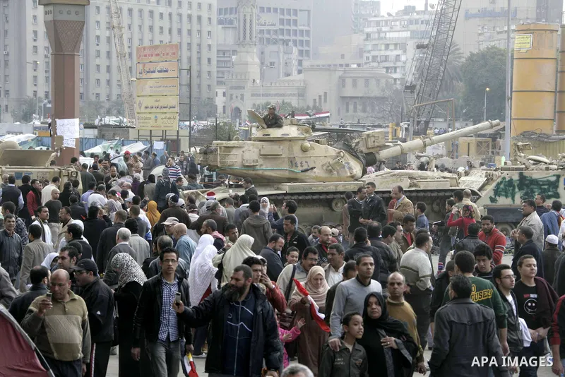 Anti-government protesters take part in demonstrations in Tahrir Square in downtown Cairo, Egypt, Tuesday, Feb. 8, 2011. Protesters appear to have settled in for a long standoff, turning Tahrir Square into a makeshift vi...