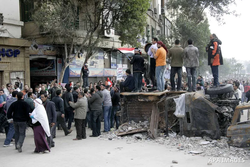 Anti-government protesters take part in demonstrations in Tahrir Square in downtown Cairo, Egypt, Tuesday, Feb. 8, 2011. Protesters appear to have settled in for a long standoff, turning Tahrir Square into a makeshift vi...