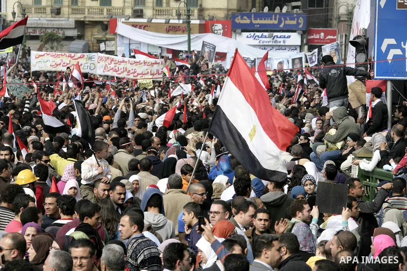 Anti-government protesters take part in demonstrations in Tahrir Square in downtown Cairo, Egypt, Tuesday, Feb. 8, 2011. Protesters appear to have settled in for a long standoff, turning Tahrir Square into a makeshift vi...