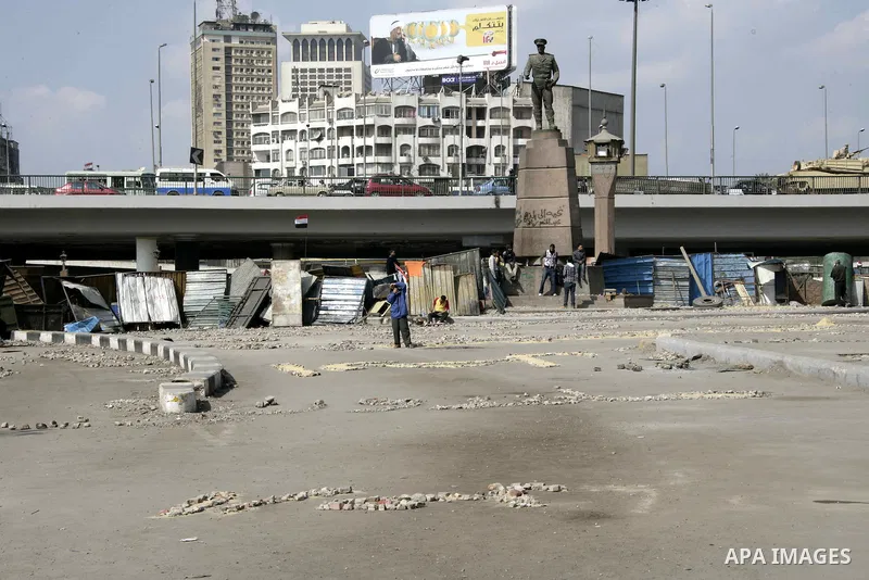 Anti-government protesters take part in demonstrations in Tahrir Square in downtown Cairo, Egypt, Tuesday, Feb. 8, 2011. Protesters appear to have settled in for a long standoff, turning Tahrir Square into a makeshift vi...
