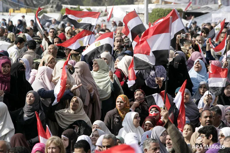 Anti-government protesters take part in demonstrations in Tahrir Square in downtown Cairo, Egypt, Tuesday, Feb. 8, 2011. Protesters appear to have settled in for a long standoff, turning Tahrir Square into a makeshift vi...