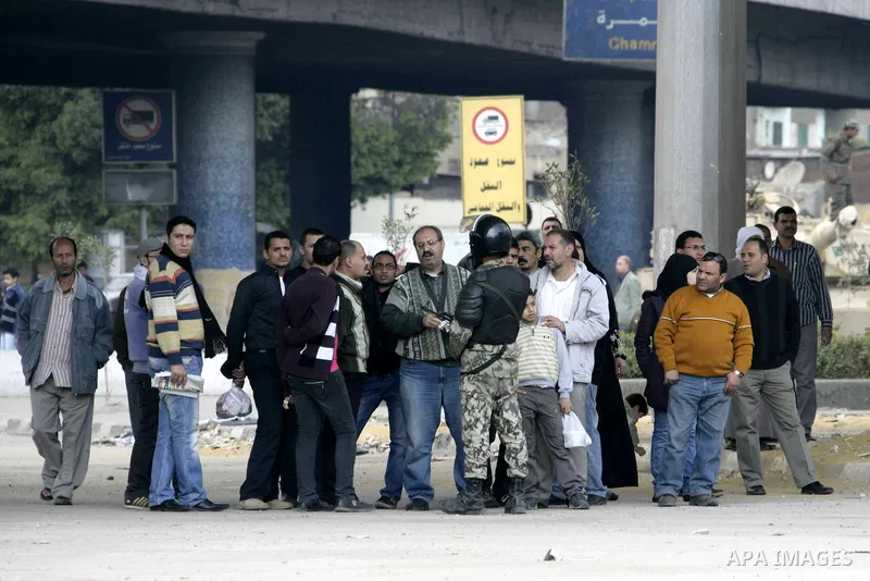Anti-government protesters take part in demonstrations in Tahrir Square in downtown Cairo, Egypt, Tuesday, Feb. 8, 2011. Protesters appear to have settled in for a long standoff, turning Tahrir Square into a makeshift vi...