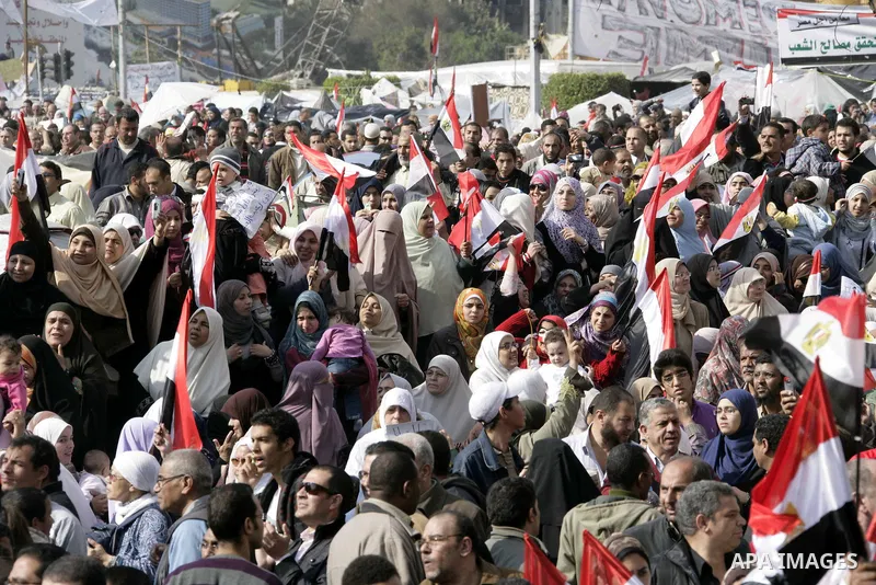 Anti-government protesters take part in demonstrations in Tahrir Square in downtown Cairo, Egypt, Tuesday, Feb. 8, 2011. Protesters appear to have settled in for a long standoff, turning Tahrir Square into a makeshift vi...