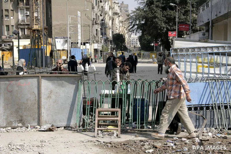 Anti-government protesters take part in demonstrations in Tahrir Square in downtown Cairo, Egypt, Tuesday, Feb. 8, 2011. Protesters appear to have settled in for a long standoff, turning Tahrir Square into a makeshift vi...