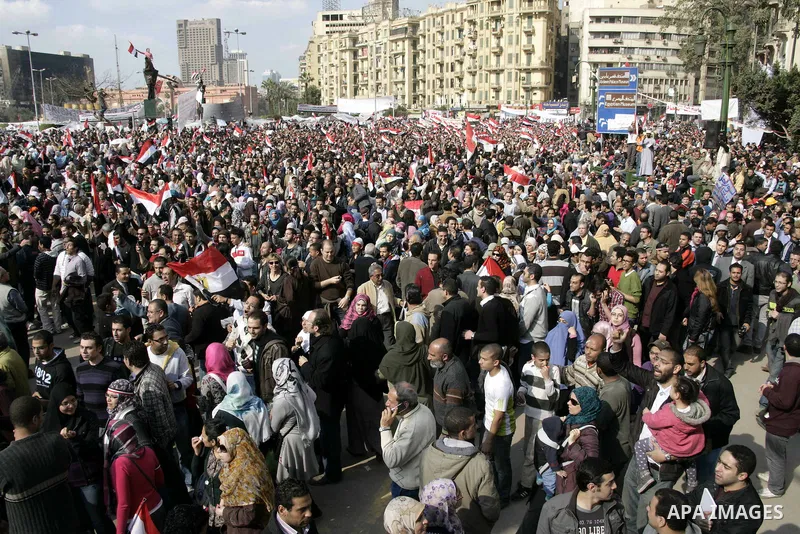 Anti-government protesters take part in demonstrations in Tahrir Square in downtown Cairo, Egypt, Tuesday, Feb. 8, 2011. Protesters appear to have settled in for a long standoff, turning Tahrir Square into a makeshift vi...
