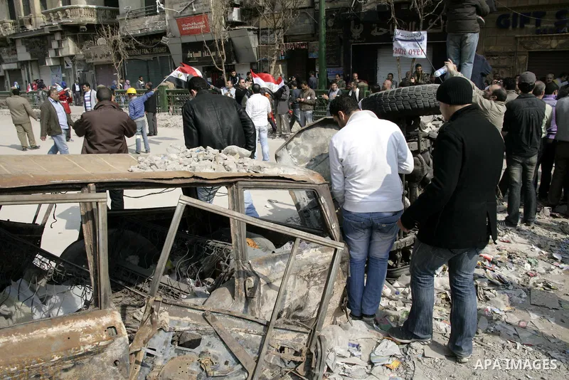 Anti-government protesters take part in demonstrations in Tahrir Square in downtown Cairo, Egypt, Tuesday, Feb. 8, 2011. Protesters appear to have settled in for a long standoff, turning Tahrir Square into a makeshift vi...