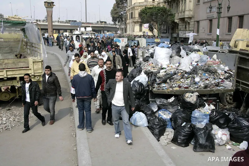 Anti-government protesters take part in demonstrations in Tahrir Square in downtown Cairo, Egypt, Tuesday, Feb. 8, 2011. Protesters appear to have settled in for a long standoff, turning Tahrir Square into a makeshift vi...