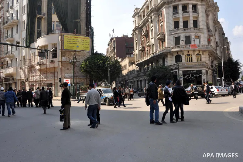 Anti-government protesters take part in demonstrations in Tahrir Square in downtown Cairo, Egypt, Tuesday, Feb. 8, 2011. Protesters appear to have settled in for a long standoff, turning Tahrir Square into a makeshift vi...