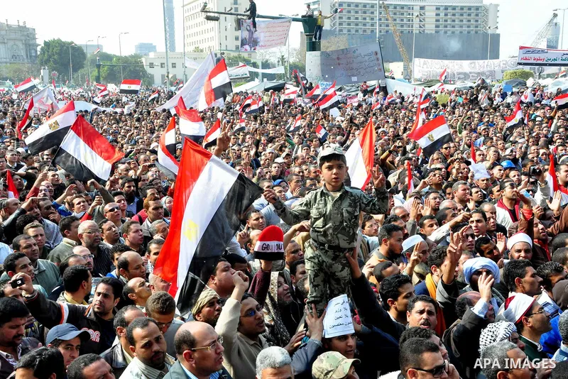 Anti-government protesters take part in demonstrations in Tahrir Square in downtown Cairo, Egypt, Tuesday, Feb. 8, 2011. Protesters appear to have settled in for a long standoff, turning Tahrir Square into a makeshift vi...