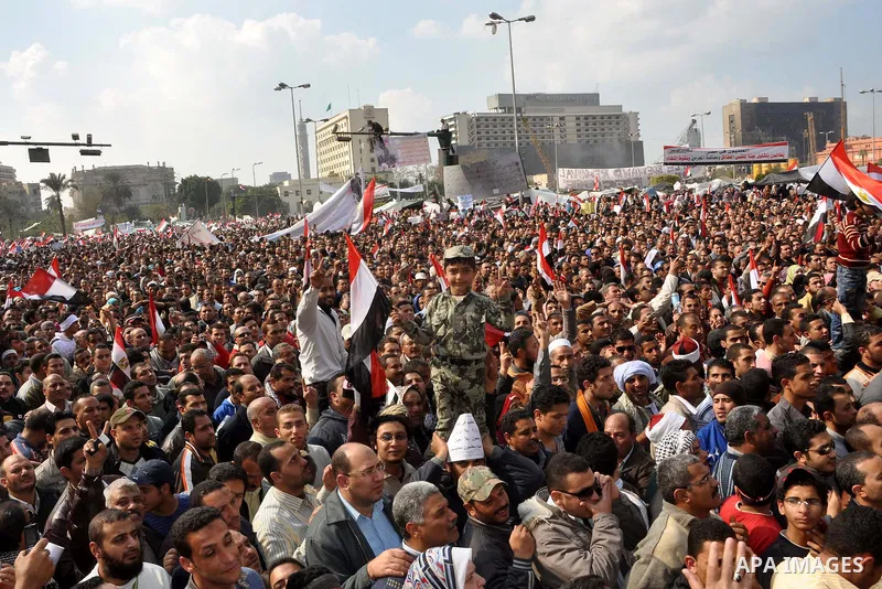 Anti-government protesters take part in demonstrations in Tahrir Square in downtown Cairo, Egypt, Tuesday, Feb. 8, 2011. Protesters appear to have settled in for a long standoff, turning Tahrir Square into a makeshift vi...