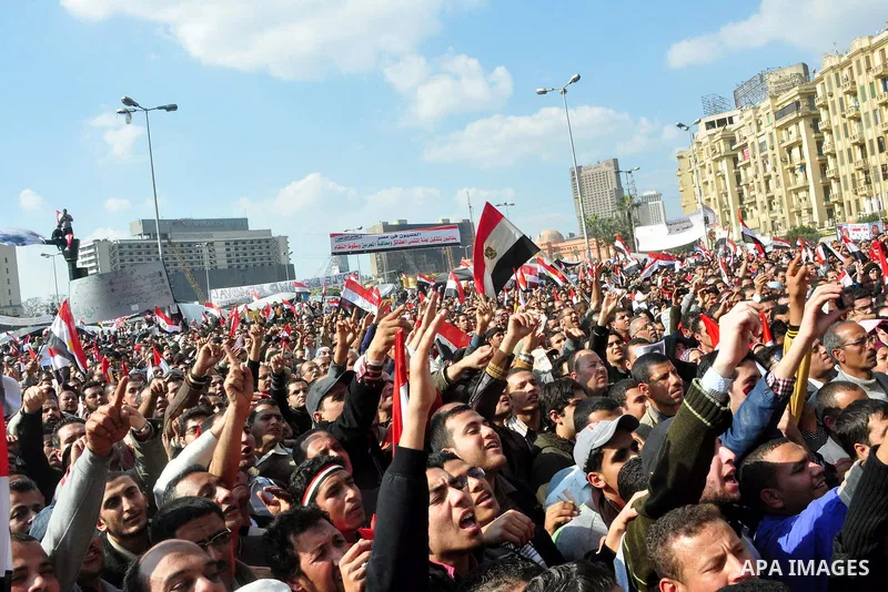 Anti-government protesters take part in demonstrations in Tahrir Square in downtown Cairo, Egypt, Tuesday, Feb. 8, 2011. Protesters appear to have settled in for a long standoff, turning Tahrir Square into a makeshift vi...