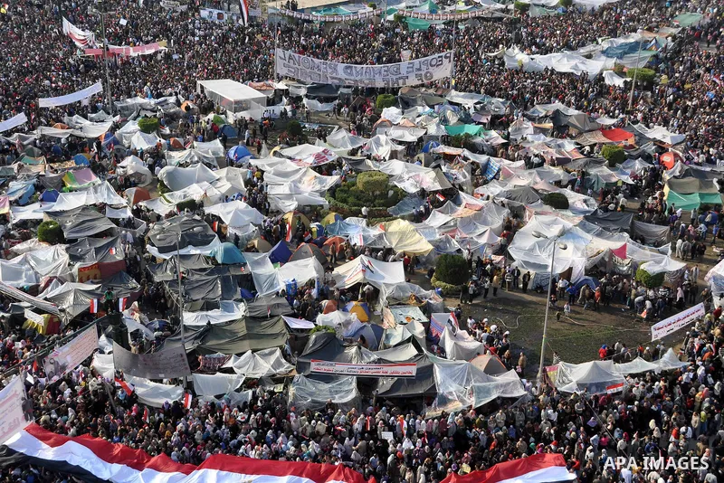 Anti-government protesters take part in demonstrations in Tahrir Square in downtown Cairo, Egypt, Tuesday, Feb. 8, 2011. Protesters appear to have settled in for a long standoff, turning Tahrir Square into a makeshift vi...