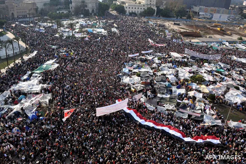 Anti-government protesters take part in demonstrations in Tahrir Square in downtown Cairo, Egypt, Tuesday, Feb. 8, 2011. Protesters appear to have settled in for a long standoff, turning Tahrir Square into a makeshift vi...