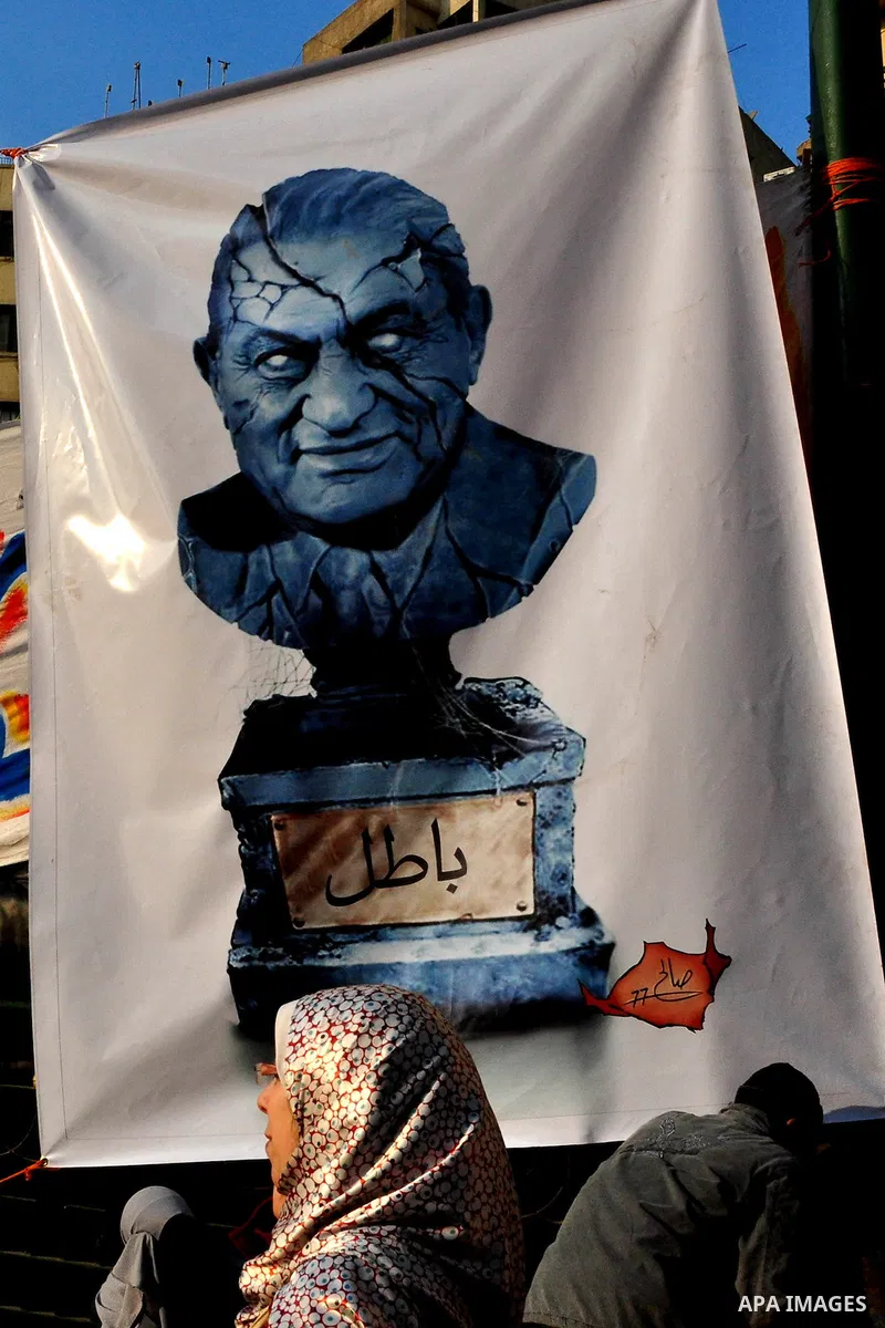Anti-government protesters take part in demonstrations in Tahrir Square in downtown Cairo, Egypt, Tuesday, Feb. 8, 2011. Protesters appear to have settled in for a long standoff, turning Tahrir Square into a makeshift vi...