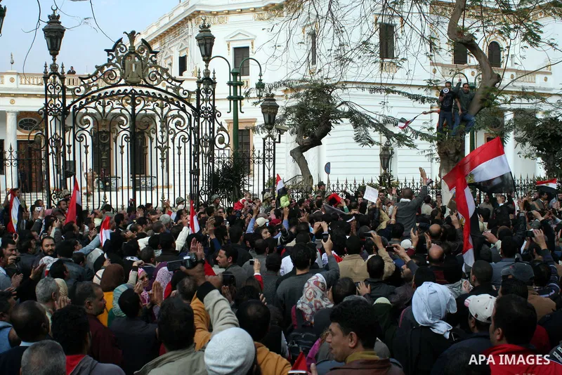 Anti-government protesters take part in demonstrations in Tahrir Square in downtown Cairo, Egypt, Tuesday, Feb. 8, 2011. Protesters appear to have settled in for a long standoff, turning Tahrir Square into a makeshift vi...