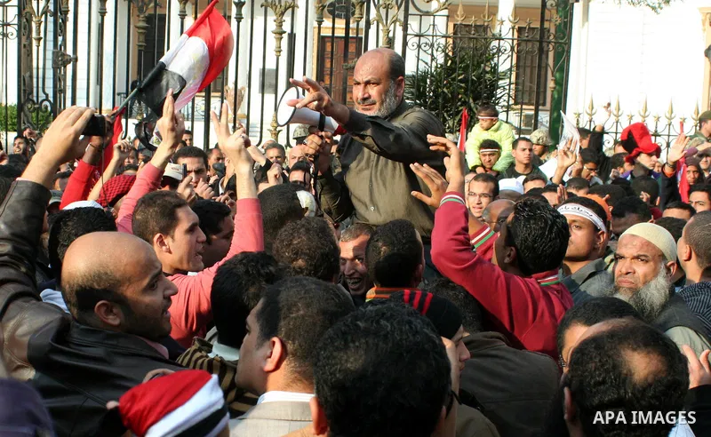 Anti-government protesters take part in demonstrations in Tahrir Square in downtown Cairo, Egypt, Tuesday, Feb. 8, 2011. Protesters appear to have settled in for a long standoff, turning Tahrir Square into a makeshift vi...