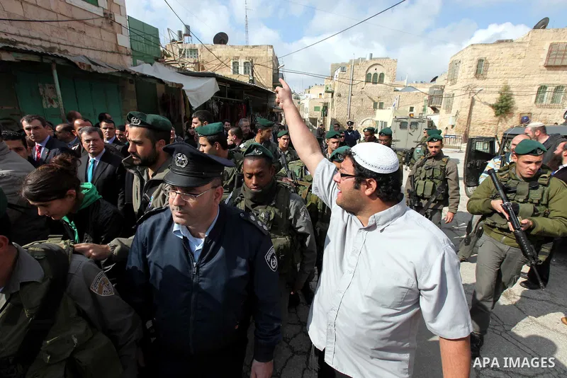 Israeli settlers from the Jewish community in Hebron demonstrate against the visit of Spanish Foreign Minister Trinidad Jimenez to the Palestinian community in the divided West Bank city of Hebron, 08 Feburary 2011. Phot...