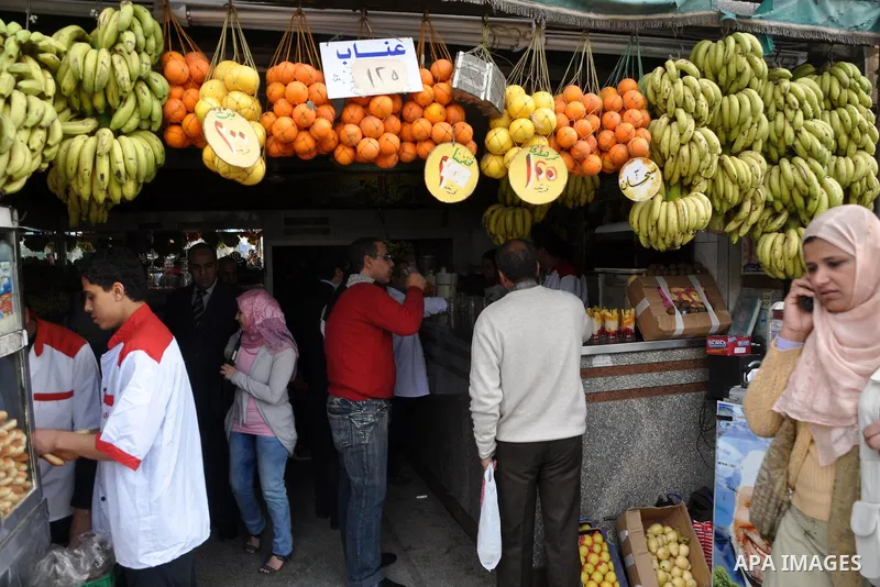 Egyptians shop at a mall in Cairo, Egypt, Tuesday, Feb. 8, 2011. Protesters appear to have settled in for a long standoff, turning Tahrir Square into a makeshift village with tens of thousands coming every day, with some...