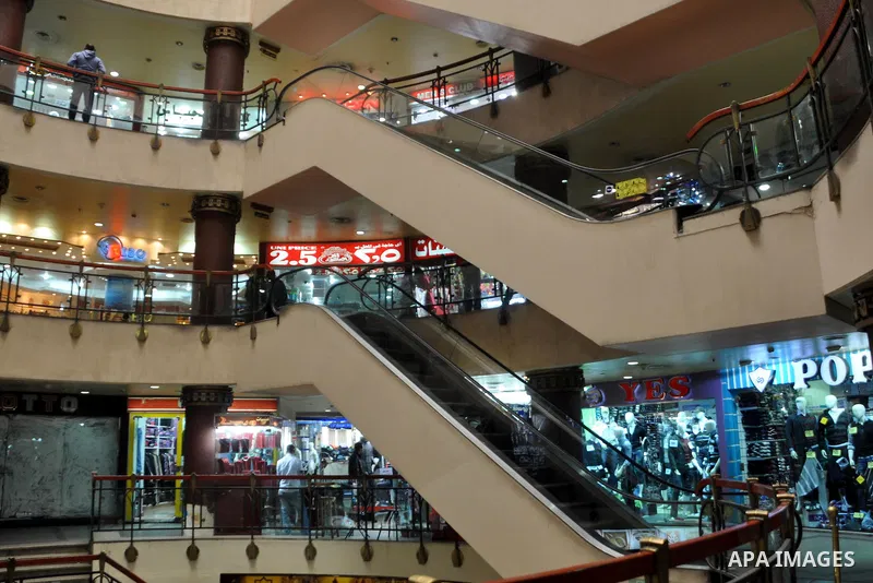 Egyptians shop at a mall in Cairo, Egypt, Tuesday, Feb. 8, 2011. Protesters appear to have settled in for a long standoff, turning Tahrir Square into a makeshift village with tens of thousands coming every day, with some...