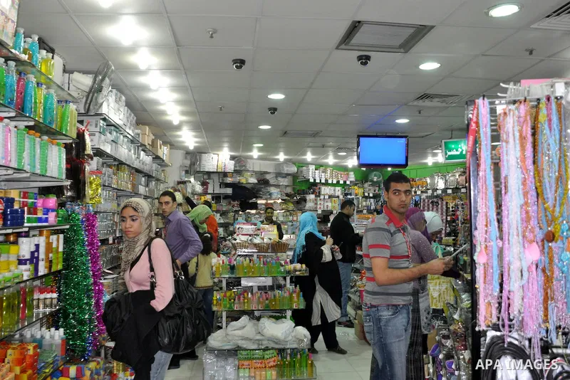 Egyptians shop at a mall in Cairo, Egypt, Tuesday, Feb. 8, 2011. Protesters appear to have settled in for a long standoff, turning Tahrir Square into a makeshift village with tens of thousands coming every day, with some...