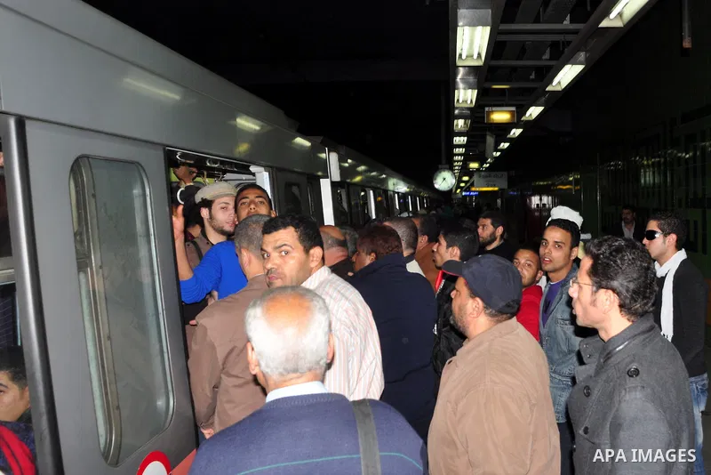 Egyptians ride a metro in Cairo, Egypt, Tuesday, Feb. 8, 2011. Protesters appear to have settled in for a long standoff, turning Tahrir Square into a makeshift village with tens of thousands coming every day, with some s...