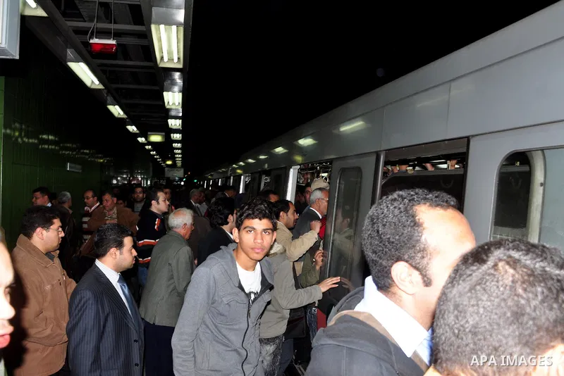 Egyptians ride a metro in Cairo, Egypt, Tuesday, Feb. 8, 2011. Protesters appear to have settled in for a long standoff, turning Tahrir Square into a makeshift village with tens of thousands coming every day, with some s...