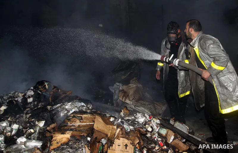 Palestinian firefighters try to extinguish a fire at a burning medicine warehouse in Gaza City, Wednesday, Feb. 9, 2011. Early Wednesday, Israeli aircraft carried out air strikes against four targets including Hamas and...
