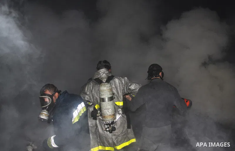 Palestinian firefighters try to extinguish a fire at a burning medicine warehouse in Gaza City, Wednesday, Feb. 9, 2011. Early Wednesday, Israeli aircraft carried out air strikes against four targets including Hamas and...