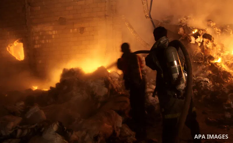 Palestinian firefighters try to extinguish a fire at a burning medicine warehouse in Gaza City, Wednesday, Feb. 9, 2011. Early Wednesday, Israeli aircraft carried out air strikes against four targets including Hamas and...