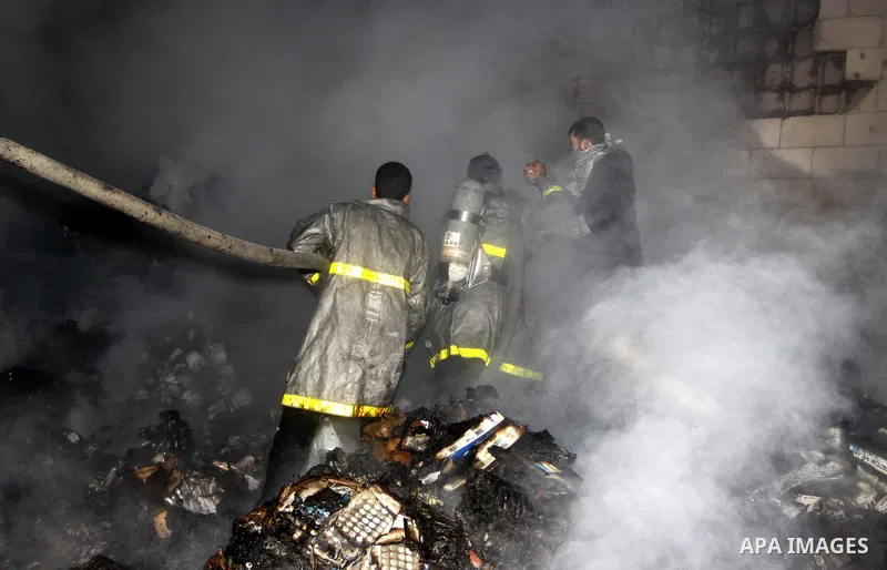 Palestinian firefighters try to extinguish a fire at a burning medicine warehouse in Gaza City, Wednesday, Feb. 9, 2011. Early Wednesday, Israeli aircraft carried out air strikes against four targets including Hamas and...