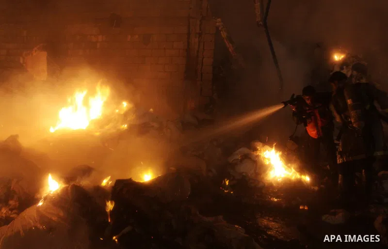 Palestinian firefighters try to extinguish a fire at a burning medicine warehouse in Gaza City, Wednesday, Feb. 9, 2011. Early Wednesday, Israeli aircraft carried out air strikes against four targets including Hamas and...