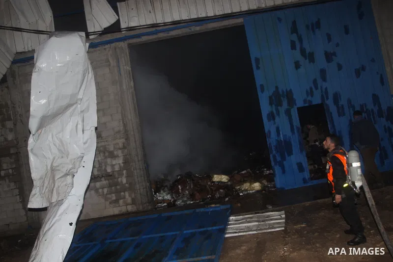 Palestinian firefighters try to extinguish a fire at a burning medicine warehouse in Gaza City, Wednesday, Feb. 9, 2011. Early Wednesday, Israeli aircraft carried out air strikes against four targets including Hamas and...
