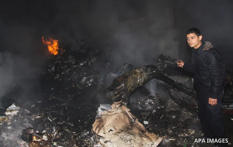 Palestinian firefighters try to extinguish a fire at a burning medicine warehouse in Gaza City, Wednesday, Feb. 9, 2011. Early Wednesday, Israeli aircraft carried out air strikes against four targets including Hamas and...