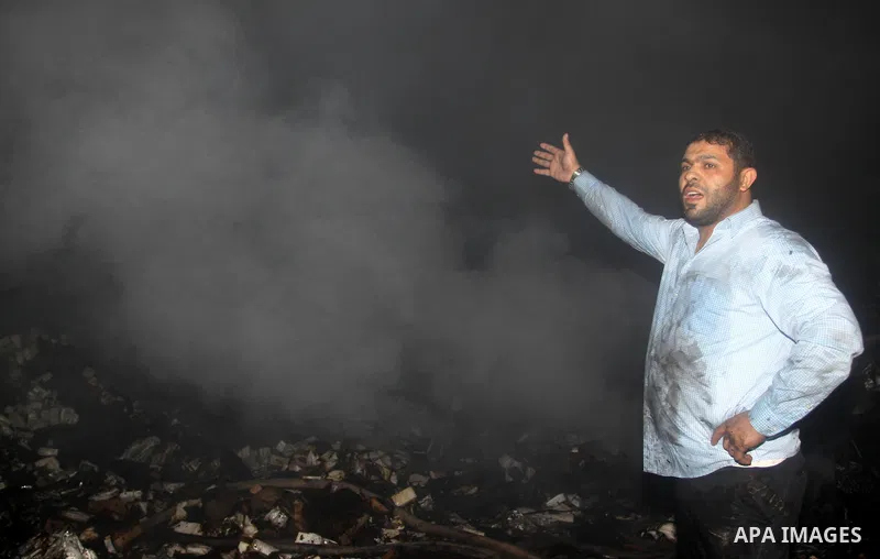 Palestinian firefighters try to extinguish a fire at a burning medicine warehouse in Gaza City, Wednesday, Feb. 9, 2011. Early Wednesday, Israeli aircraft carried out air strikes against four targets including Hamas and...