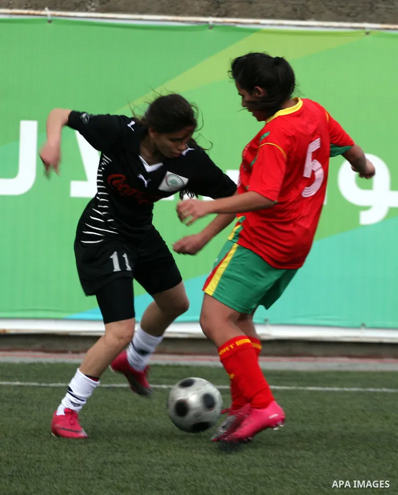 Palestinian Deyar players and Siryah Ramallah play in the opening soccer match of the Palestinian women's soccer league in the West Bank town of Aram, near Ramallah, Thursday, Feb. 10, 2011. Photo by Issam Rimawi