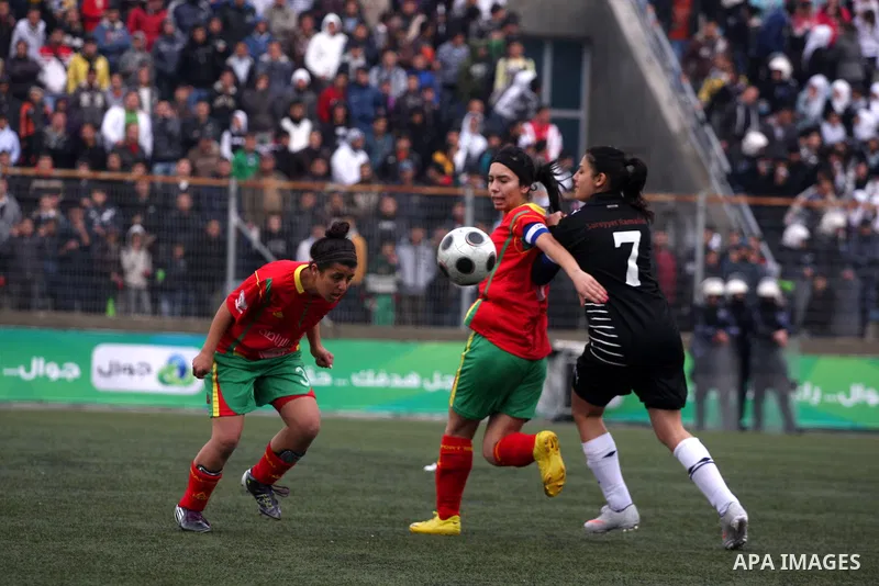 Palestinian Deyar players and Siryah Ramallah play in the opening soccer match of the Palestinian women's soccer league in the West Bank town of Aram, near Ramallah, Thursday, Feb. 10, 2011. Photo by Issam Rimawi
