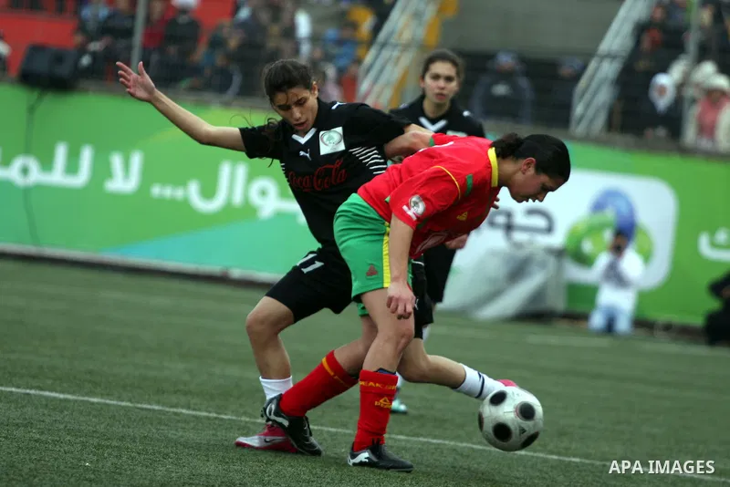 Palestinian Deyar players and Siryah Ramallah play in the opening soccer match of the Palestinian women's soccer league in the West Bank town of Aram, near Ramallah, Thursday, Feb. 10, 2011. Photo by Issam Rimawi