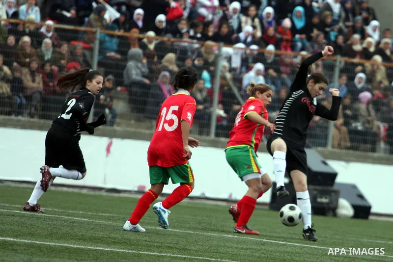 Palestinian Deyar players and Siryah Ramallah play in the opening soccer match of the Palestinian women's soccer league in the West Bank town of Aram, near Ramallah, Thursday, Feb. 10, 2011. Photo by Issam Rimawi