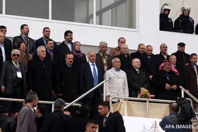 Palestinian prime minister Salam Fayyad participates the opening soccer match of the Palestinian women's soccer league between Siryah Ramallah and Deyar in the West Bank town of Aram, near Ramallah, Thursday, Feb. 10, 20...