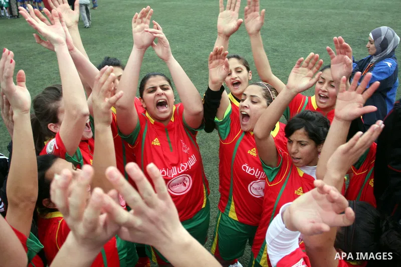 Palestinian Deyar players and Siryah Ramallah play in the opening soccer match of the Palestinian women's soccer league in the West Bank town of Aram, near Ramallah, Thursday, Feb. 10, 2011. Photo by Issam Rimawi