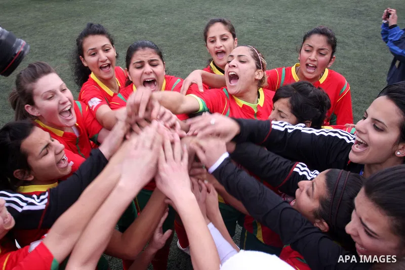 Palestinian Deyar players and Siryah Ramallah play in the opening soccer match of the Palestinian women's soccer league in the West Bank town of Aram, near Ramallah, Thursday, Feb. 10, 2011. Photo by Issam Rimawi