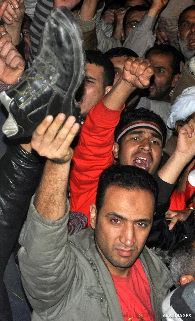 nti-government protesters hold their shoes as they react with to Egyptian President Hosni Mubarak's televised statement to his nation in Tahrir Square in downtown Cairo, Egypt Thursday, Feb. 10, 2011. Egyptian President...
