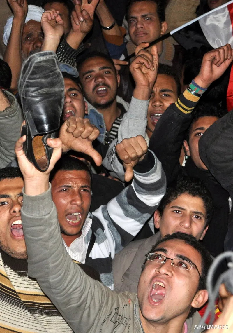 nti-government protesters hold their shoes as they react with to Egyptian President Hosni Mubarak's televised statement to his nation in Tahrir Square in downtown Cairo, Egypt Thursday, Feb. 10, 2011. Egyptian President...