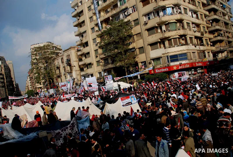 Anti-government protesters demonstrate after traditional Muslim Friday prayers at the continuing demonstration in Tahrir Square in downtown Cairo, Egypt, Friday, Feb. 11, 2011. Photo by Ahmed Asad