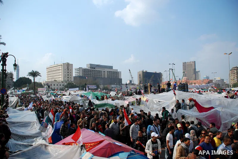Anti-government protesters demonstrate after traditional Muslim Friday prayers at the continuing demonstration in Tahrir Square in downtown Cairo, Egypt, Friday, Feb. 11, 2011. Photo by Ahmed Asad