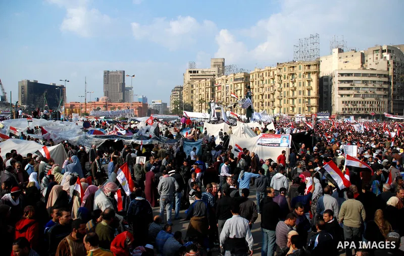 Anti-government protesters demonstrate after traditional Muslim Friday prayers at the continuing demonstration in Tahrir Square in downtown Cairo, Egypt, Friday, Feb. 11, 2011. Photo by Ahmed Asad