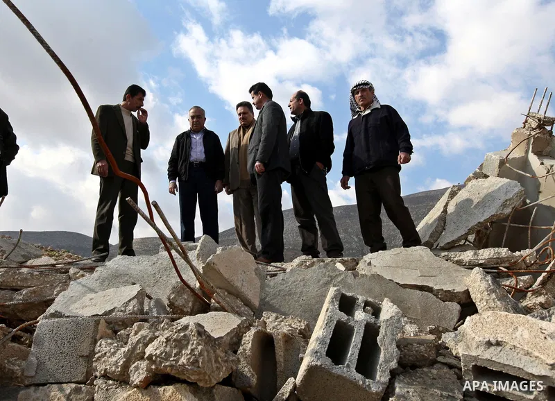 Palestinian Prime Minister Salam Fayyad visits the houses which were destroyed by Israeli army in the village of Khirbet Tana near the West Bank city of Nablus, Feb. 11, 2011. Photo by Mustafa Abu Dayeh