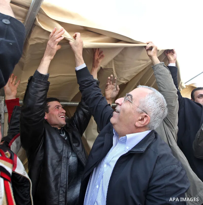 Palestinian Prime Minister Salam Fayyad visits the houses which were destroyed by Israeli army in the village of Khirbet Tana near the West Bank city of Nablus, Feb. 11, 2011. Photo by Mustafa Abu Dayeh