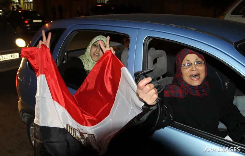 Palestinians celebrate the news of the resignation of President Hosni Mubarak, who handed control of the country to the military, at night in Gaza city, Friday, Feb. 11, 2011 Photo by Naaman Omar